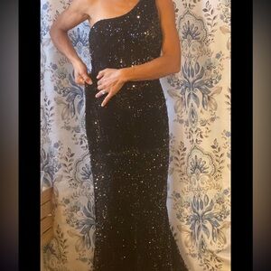 One shoulder black sequin dress. Bottom is slight high-low. Stunning & stretchy.